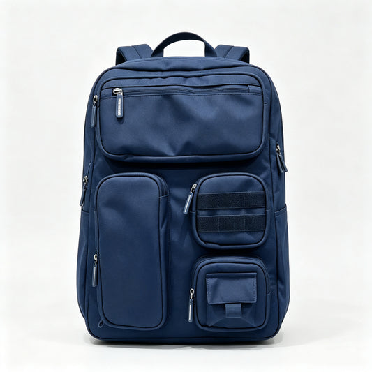 A navy blue multi-compartment backpack with multiple zippered pockets and a top handle, photographed against a clean white studio background.
