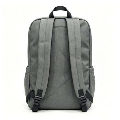 The back view of a gray fabric backpack with black straps and plastic buckles, shown against a plain white background.