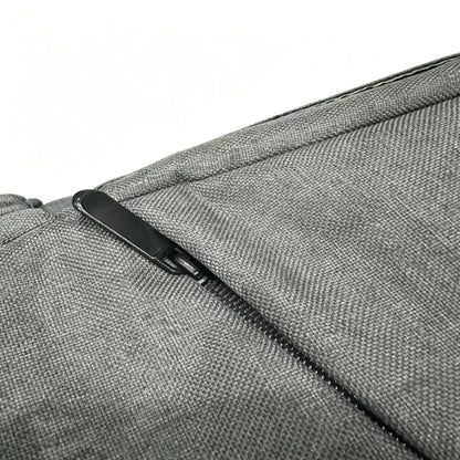 Close-up of a gray textured fabric bag with a black zipper pull on a white background.