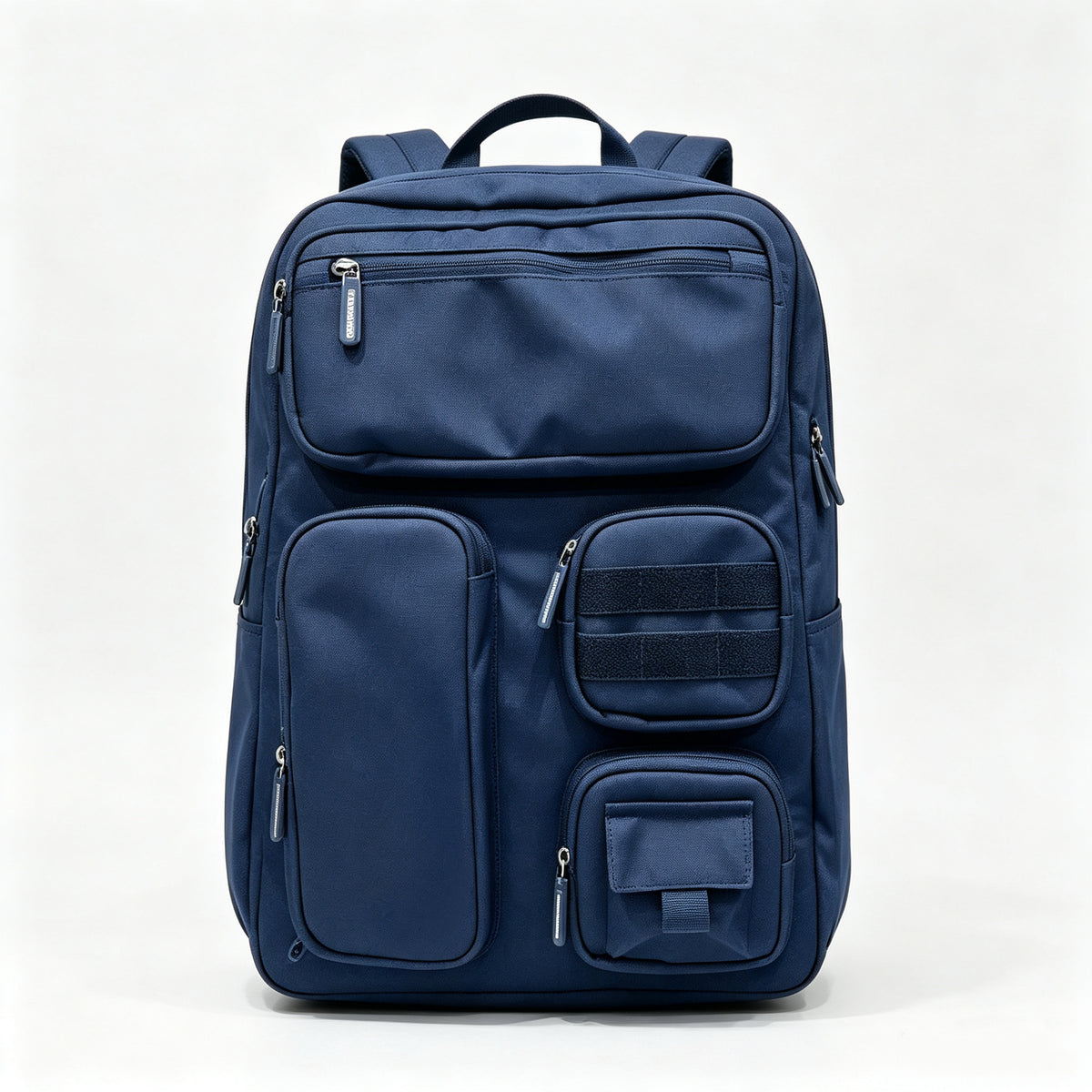 A navy blue multi-compartment backpack with multiple zippered pockets and a top handle, photographed against a clean white studio background.