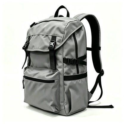 A gray nylon backpack with black straps, zippers, and buckles, shown from a three-quarter angle on a white background.