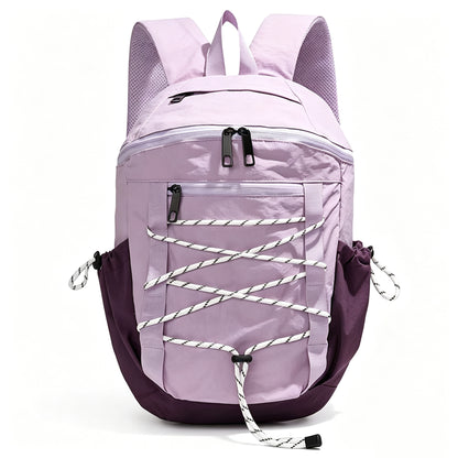 A light purple and dark purple backpack with white-and-black striped lacing details across the front pocket, shown on a clean white background.