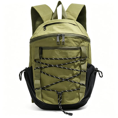 An olive green and black backpack with a front zippered pocket and decorative black-and-white lacing across the front, shown on a plain white background.